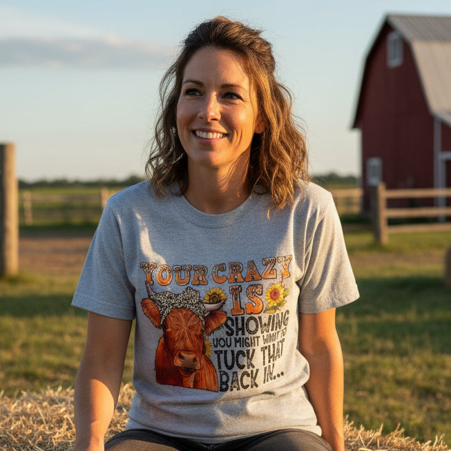 Gray sweatshirt with a cow graphic and humorous text